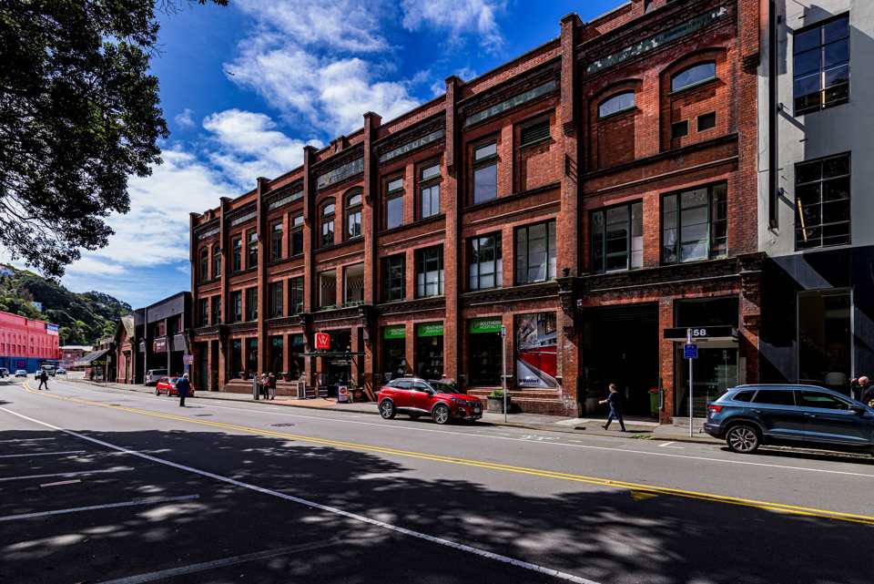 A photo of the team's collaborative workspace with sticky notes and design sketches.